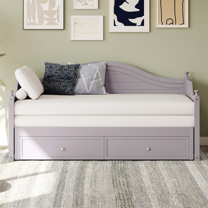 Lit de jour simple en bois avec couchette coulissante et rangement, fabrication durable pour chambre d'amis ou espace de vie.