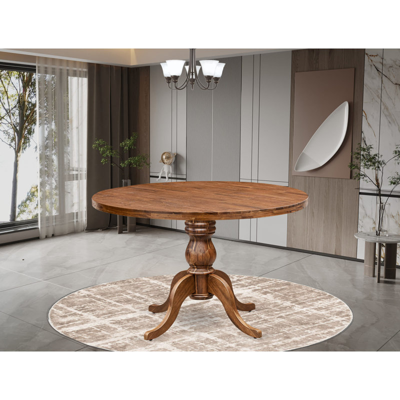 Une table de salle à manger avec un plateau rond et un piédestal élégant, finition noyer antique., Noyer antique