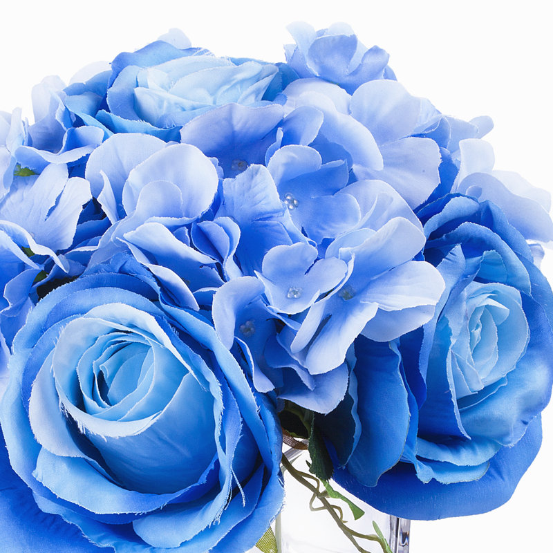 Arrangement d'hortensias dans un vase en verre, Bleu