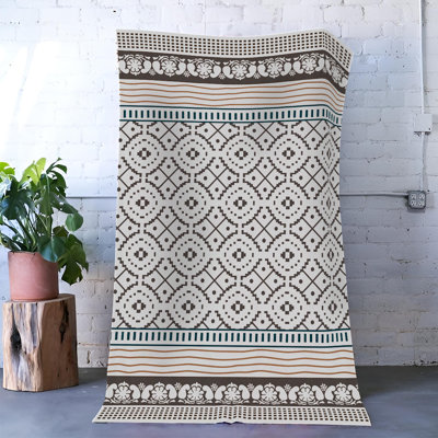 Tapis décoratif moderne à motif floral à bordure beige