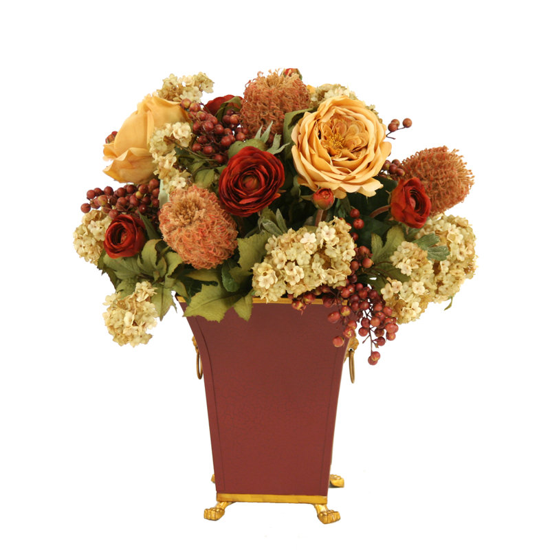 Or antique, rouille, rouge, mélange de vert et de brun dans un pot à fleurs