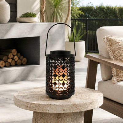 A Battery Operated lantern lamp creates an LED Flame Effect and can be used hanging or on a tabletop for indoor or outdoor decoration.