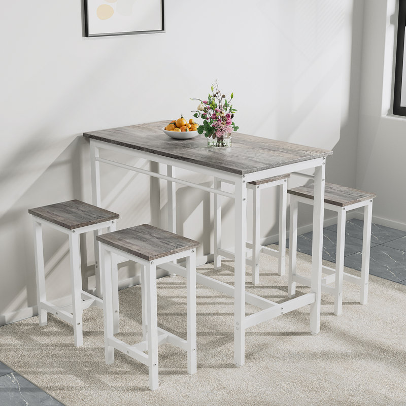 Ensemble de table de cuisine moderne cinq pièces avec quatre tabourets de bar, idéal pour les dîners de famille et les petites réunions, multifonctionnel pour divers espaces.