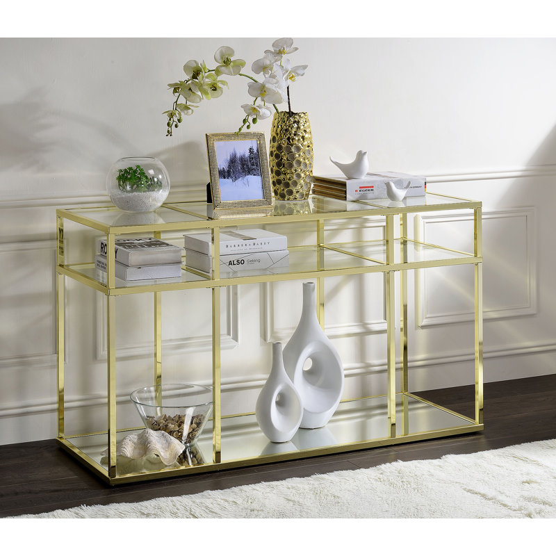 Table de canapé en verre transparent et finition dorée avec plateau en verre trempé et structure en métal, parfaite pour les décors modernes et les petits espaces