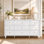 Commode 9 tiroirs l 63 po avec 3 grands tiroirs centraux et boutons dorés