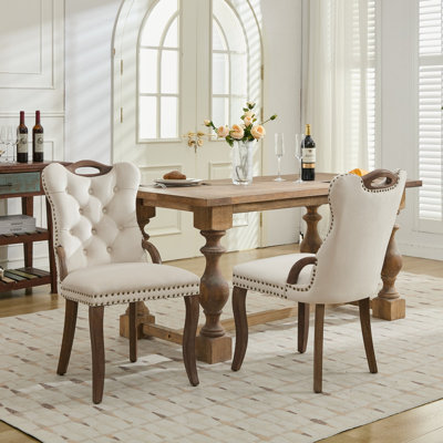 Chaise de salle à manger en velours avec garniture touffetée à la main, poignées en bois massif sur le dessus et les côtés, décoration cloutée en cuivre rétro, pieds courbés en bois massif, forme générale élégante, ensemble de 2,