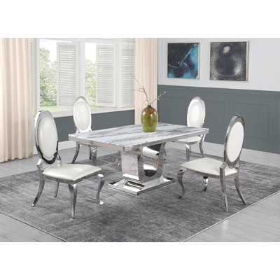 Ensemble de salle à manger en marbre blanc Sipes avec chaises en similicuir blanc Sipes