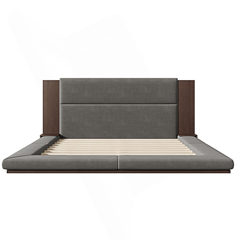 Lit plateforme au sol avec tête de lit allongée et tablette de chevet