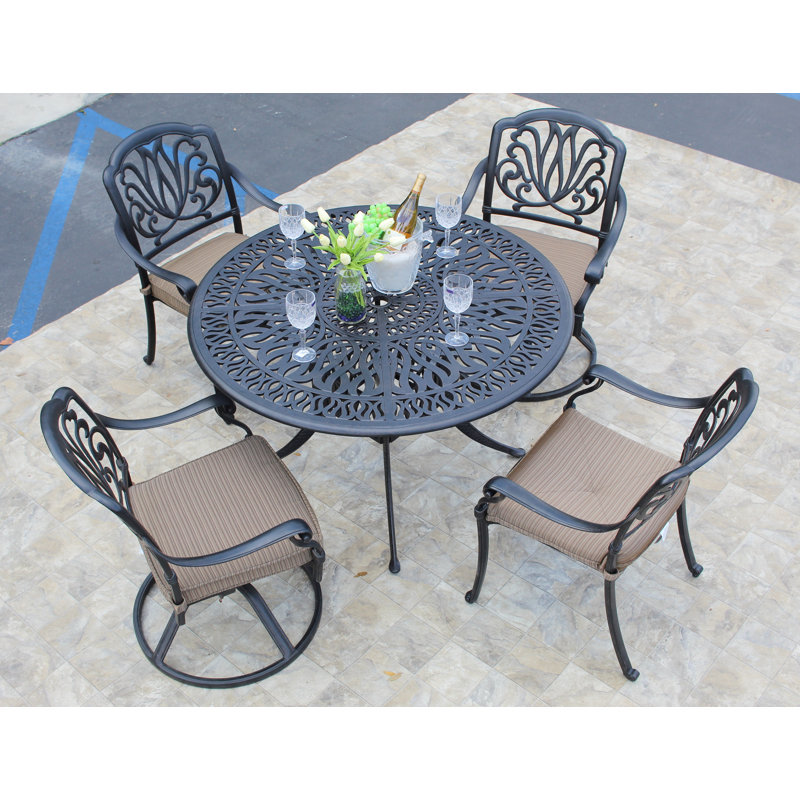 Weaubleau 4 - Person Patio Dining Set with Round Table , Cushions Included