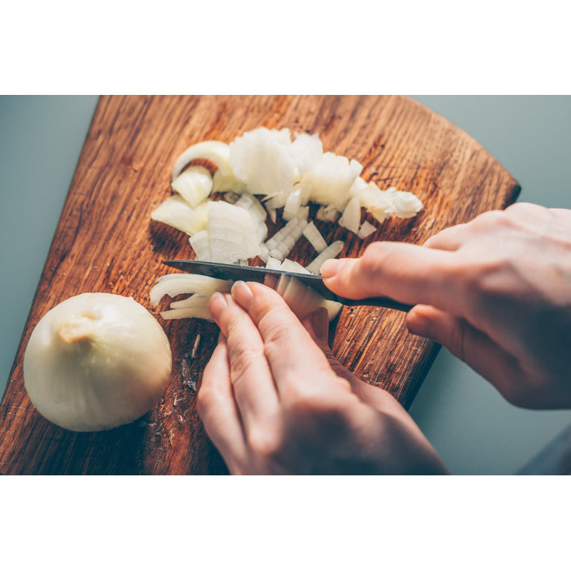 The Cook Cuts The Onion On A Cutting Board - Wrapped Canvas Print, 30cm H x 46cm W x 3.8cm D