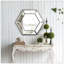 Miroir mural hexagonal au design contemporain en verre