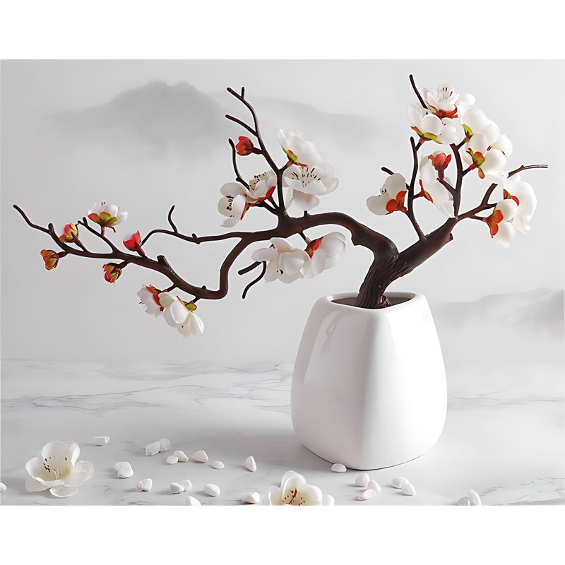 Arrangement de fleurs de prunier en pot