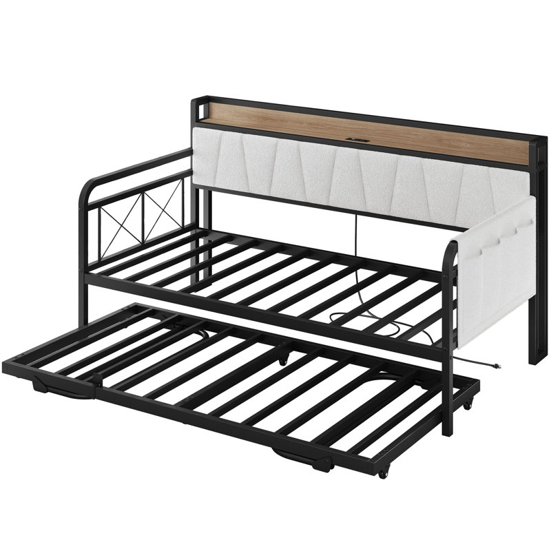 Lit de jour convertible peu encombrant, comprend un lit gigogne escamotable et une tête de lit avec rangement et prises USB