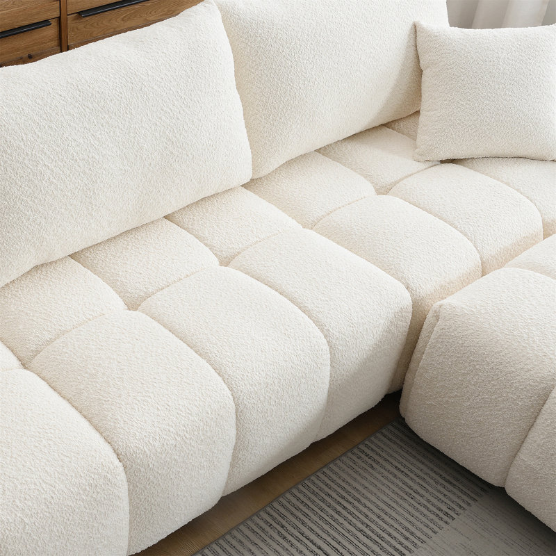 Canapé modulaire de 110 po en forme de L avec siège très grand, conception en ligne, repose-pieds mobile, mousse haute densité, combinaison libre, structure en métal et bois robuste, tissu bouclé, 3 couleurs