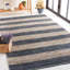 Tapis en cuir tissé à la main / à rayures en jute gris foncé / brun Gered-538620558