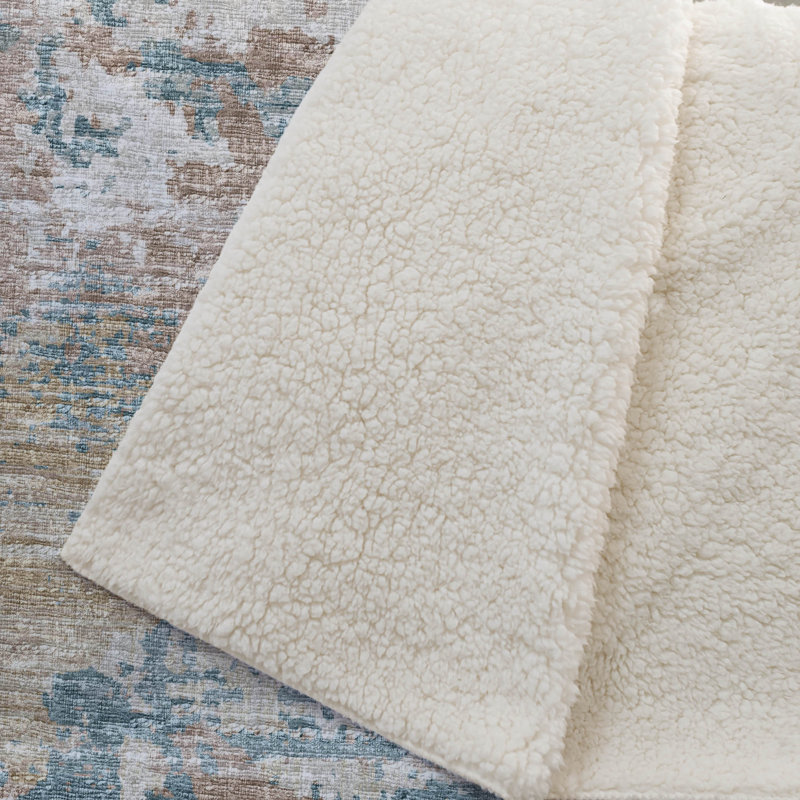 Couverture en sherpa ivoire One Pixie Street 127 x 178 cm, couleur ivoire, Ivoire; beige; bleu sarcelle; or