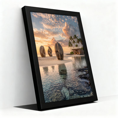 Stone Sculptures and Palm Trees on Beach at Sunset Canvas Wall Art