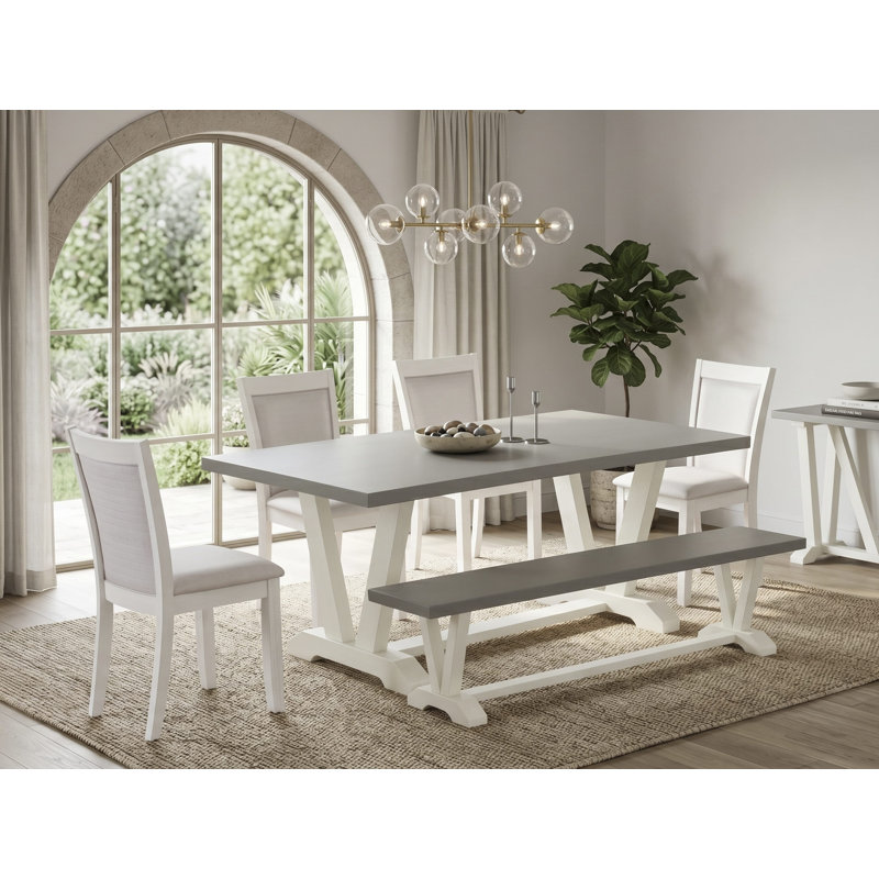 L'ensemble de table à manger de 6 pièces comprend une table rectangulaire en ciment, un banc en bois et 4 chaises rembourrées en tissu de lin crème avec un haut dossier en lin brossé blanc.