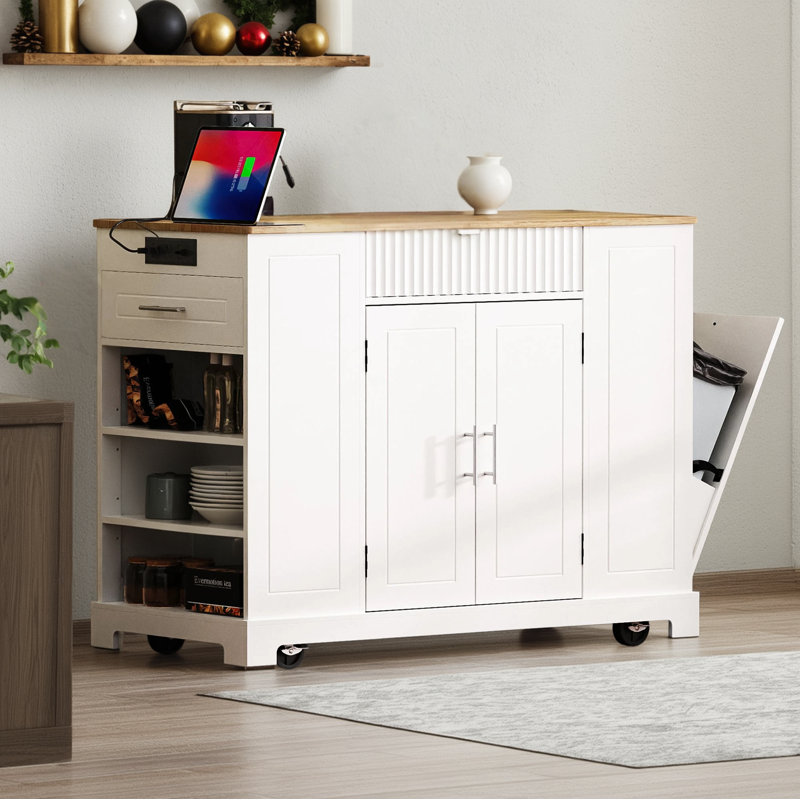 The Kitchen Island With Slots Is A 5-Wheel Rolling Unit And Includes Trash Can Storage, Electrical Outlets, Interior Storage Shelves, 3 Drawers, And 3 Open Side Shelves That Accommodate 10-Gallon Trash Cans.