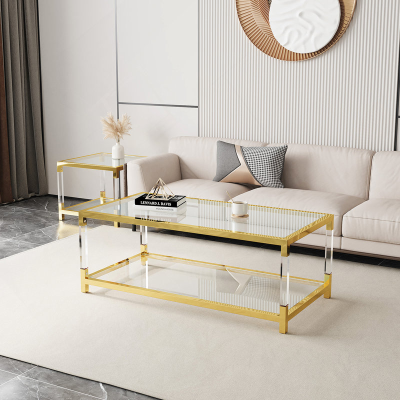 Table basse en métal doré de style moderne minimaliste avec pieds en acrylique
