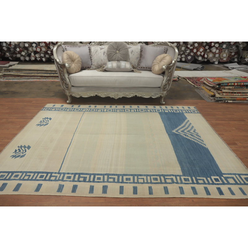 Tapis rustique bleu et crème à motifs géométriques 6 x 8