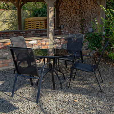 Anaum 4 - Person Patio Dining Set with Round Table