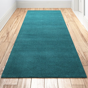 https://assets.wfcdn.com/im/60721946/resize-h310-w310%5Ecompr-r85/2066/206658141/girton-handmade-hand-loomed-wool-teal-rug.jpg