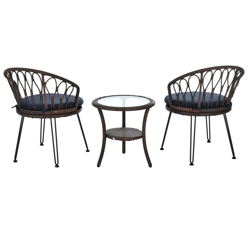 Ensemble de patio confortable en rotin avec table en verre pour une vie en plein air élégante