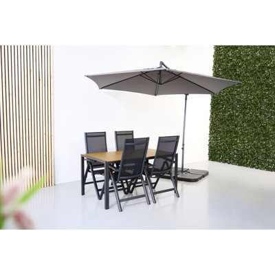 Oriska 4 - Person Wicker Patio Dining Set with Rectangular Table