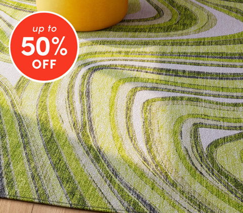 Area rugs up to 50% off featuring green and gray swirl pattern rug with yellow ottoman