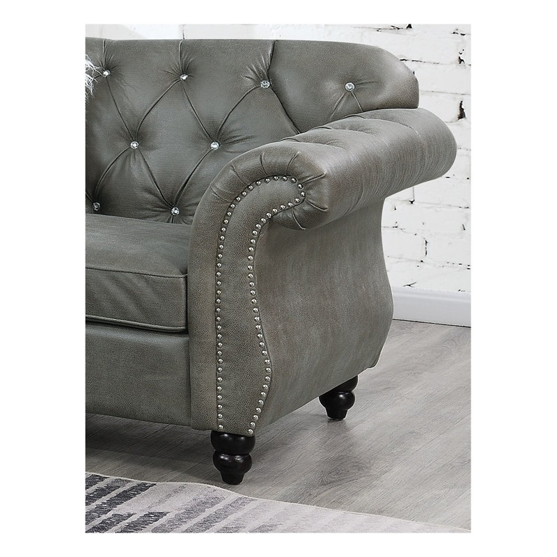 Canapé d'angle 4 pièces en similicuir respirant gris ardoise, avec méridienne, causeuse et fauteuil sans accoudoirs.
