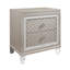 Table de chevet CROSS GLAM CHAMPAGNE avec pieds en acrylique et quincaillerie ornée de bijoux, parfaite pour le rangement élégant de la chambre à coucher