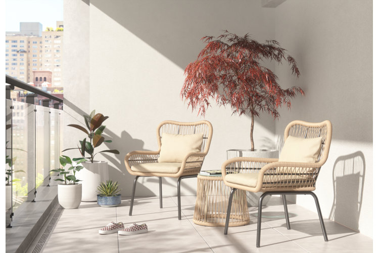 Apartment balcony with two lounge chairs.