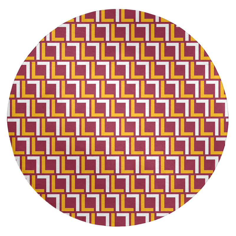 Tapis rond rouge / jaune à motif géométrique
