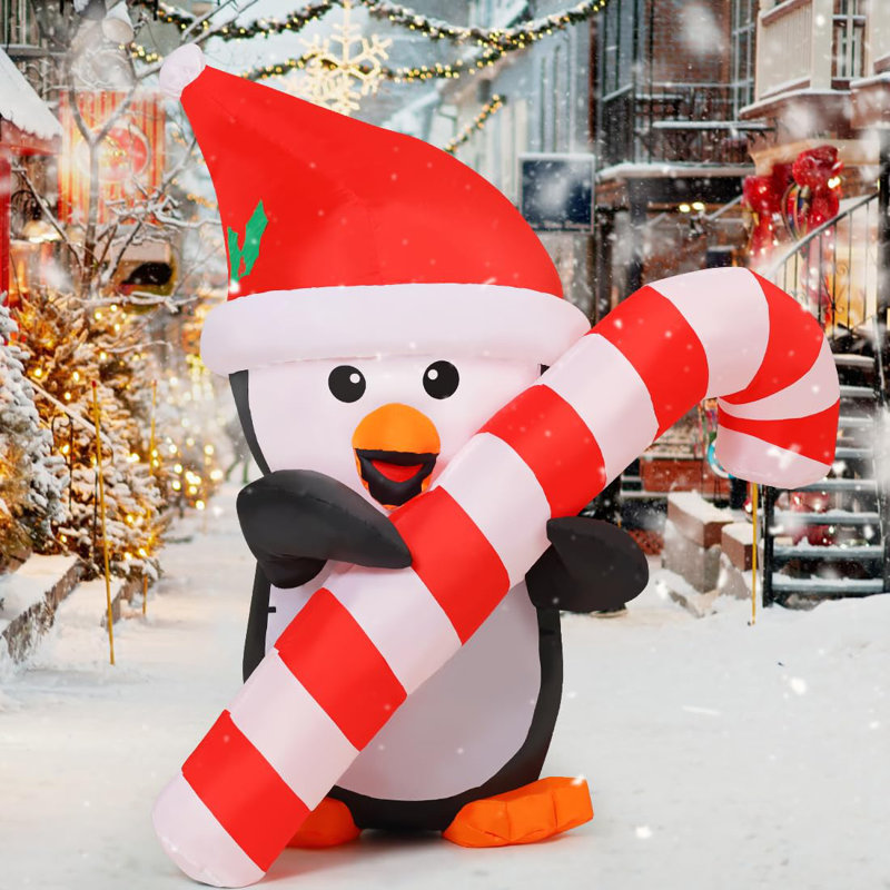 Pingouin gonflable de Noël GOOSH 5 pi tenant une canne de bonbon avec lumières DEL intégrées