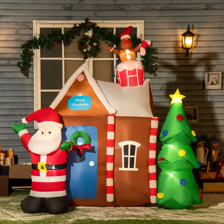 https://assets.wfcdn.com/im/60804933/resize-h755-w755%5Ecompr-r85/2183/218375703/Gingerbread+House+with+Santa+Claus+and+Christmas+Tree+Inflatable+Set.jpg