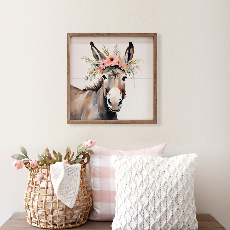 Âne avec couronne de fleurs blanche