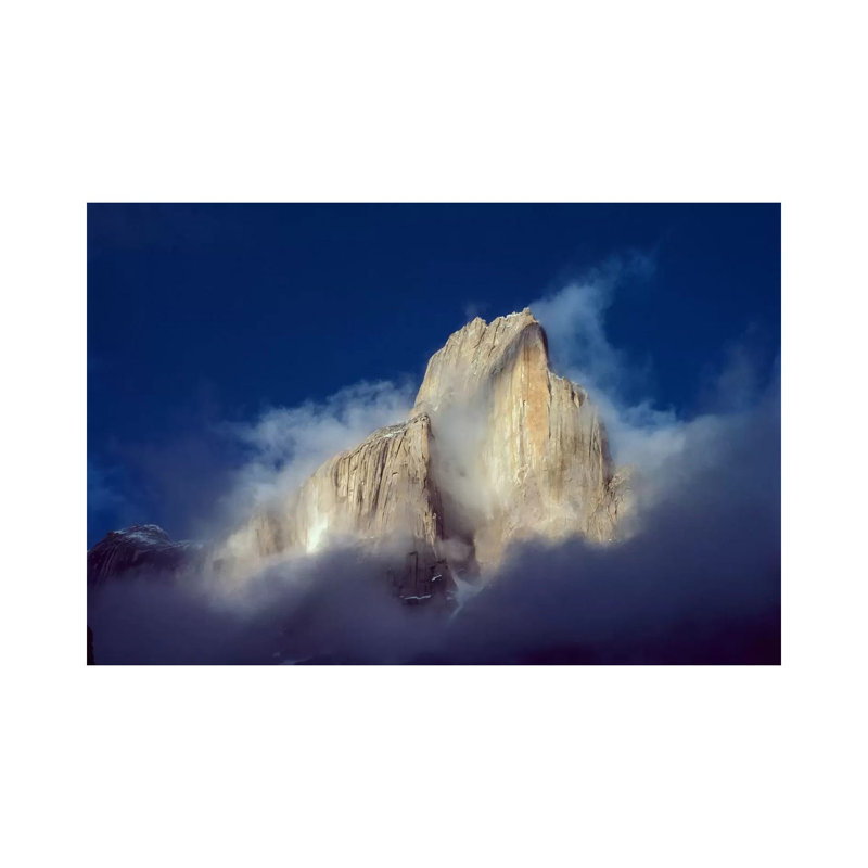 Trango Tower In Morning Mist, Karakoran Mountains, Pakistan by Geoff Gabites - Wrapped Canvas Print