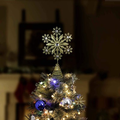 Pointe d'arbre en forme de flocon de neige scintillant