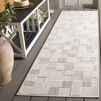 Tapis d'intérieur / extérieur à motif géométrique Sanchia Performance