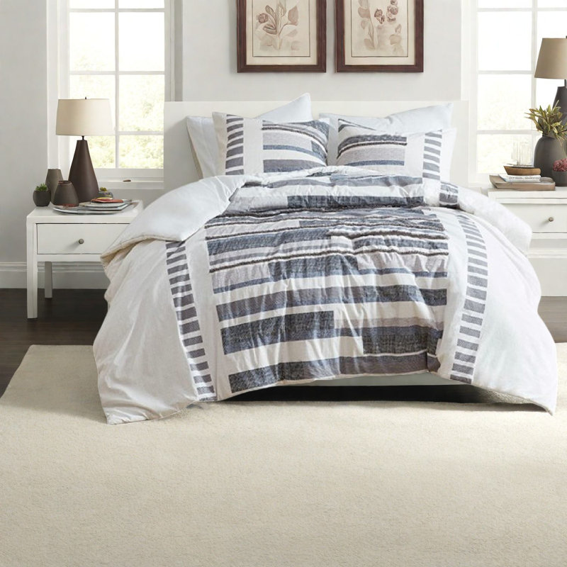 Ensemble de literie en coton moderne, imprimé bleu marine et gris avec détails de franges pour le confort de la maison
