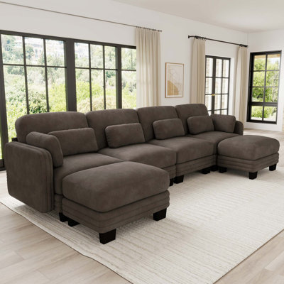 Canapé d'angle modulaire capitonné avec poufs amovibles