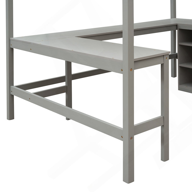 Lit mezzanine avec tablettes et bureau intégrés, offrant beaucoup de rangement et un espace de travail dédié pour une utilisation efficace de l'espace