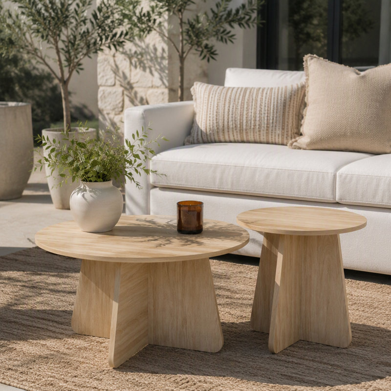 Retro-style nesting coffee table set. Available in walnut or natural wood finishes. Round nesting side tables with crisscross legs. Ideal for living rooms and dining rooms.