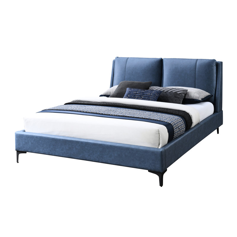 Lit tapissier bleu avec tête de lit rembourrée et plateforme somptueuse