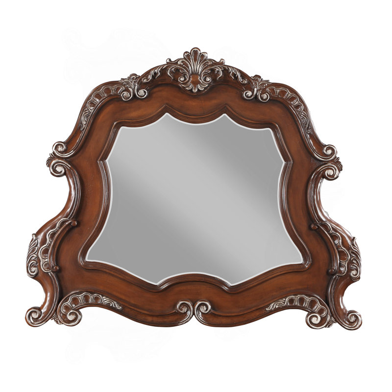 Magnifique miroir avec des volutes complexes et une finition luxueuse, un ajout étonnant à tout espace
