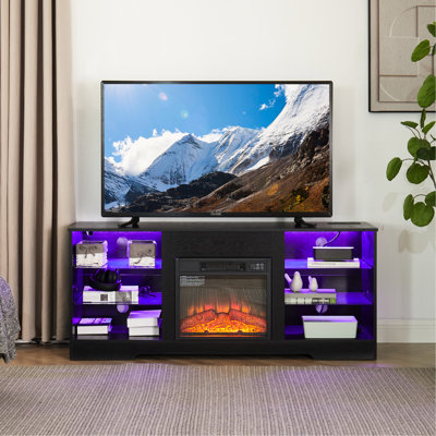 Table télé avec foyer électrique intégré, noir, 147 cm (l) x 39 cm (p) x 62 cm (h), compatible avec les téléviseurs de 32 à 62 pouces. Équipée d'un éclairage DEL et d'un port de chargement. Meuble télé moderne avec foyer, effet flamme 3D, éclairage et chargement.