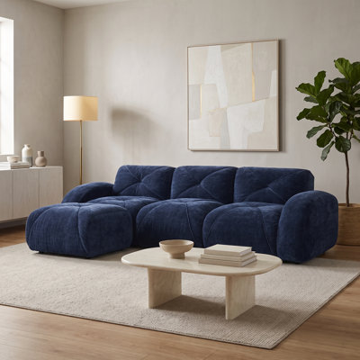 Canapé modulable 3 places bleu marine en velours sans structure, avec pouf amovible et coussins capitonnés