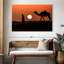 Silhouette d'homme et de chameau-690565889