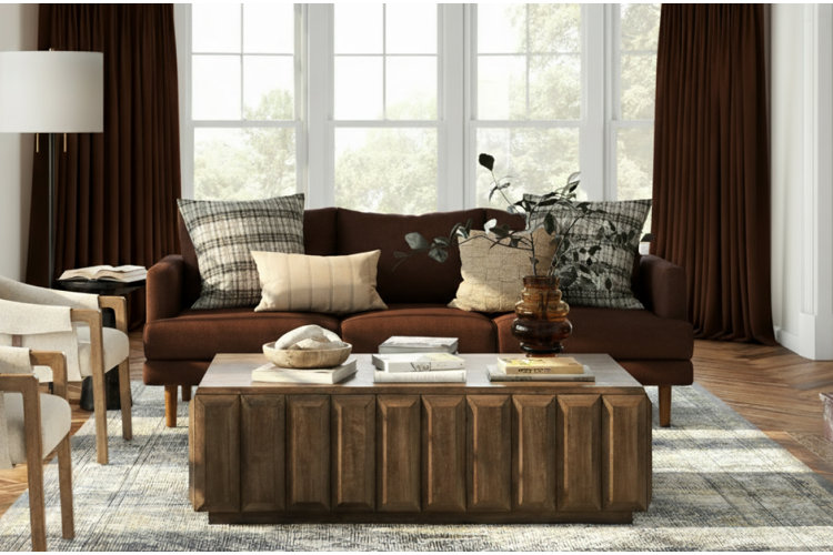 modern living room with a chocolate brown sofa, dark brown drapes, and a modern wood coffee table